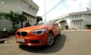 BMW 1 Series  116i  2014 - Chính chủ bán BMW 1 Series 116i đời 2014, màu cam