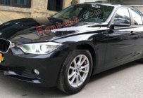 BMW 3 Series 320i 2012 - Cần bán xe BMW 320i sản xuất 2012, model 2013 màu đen giá 720 triệu tại Hà Nội